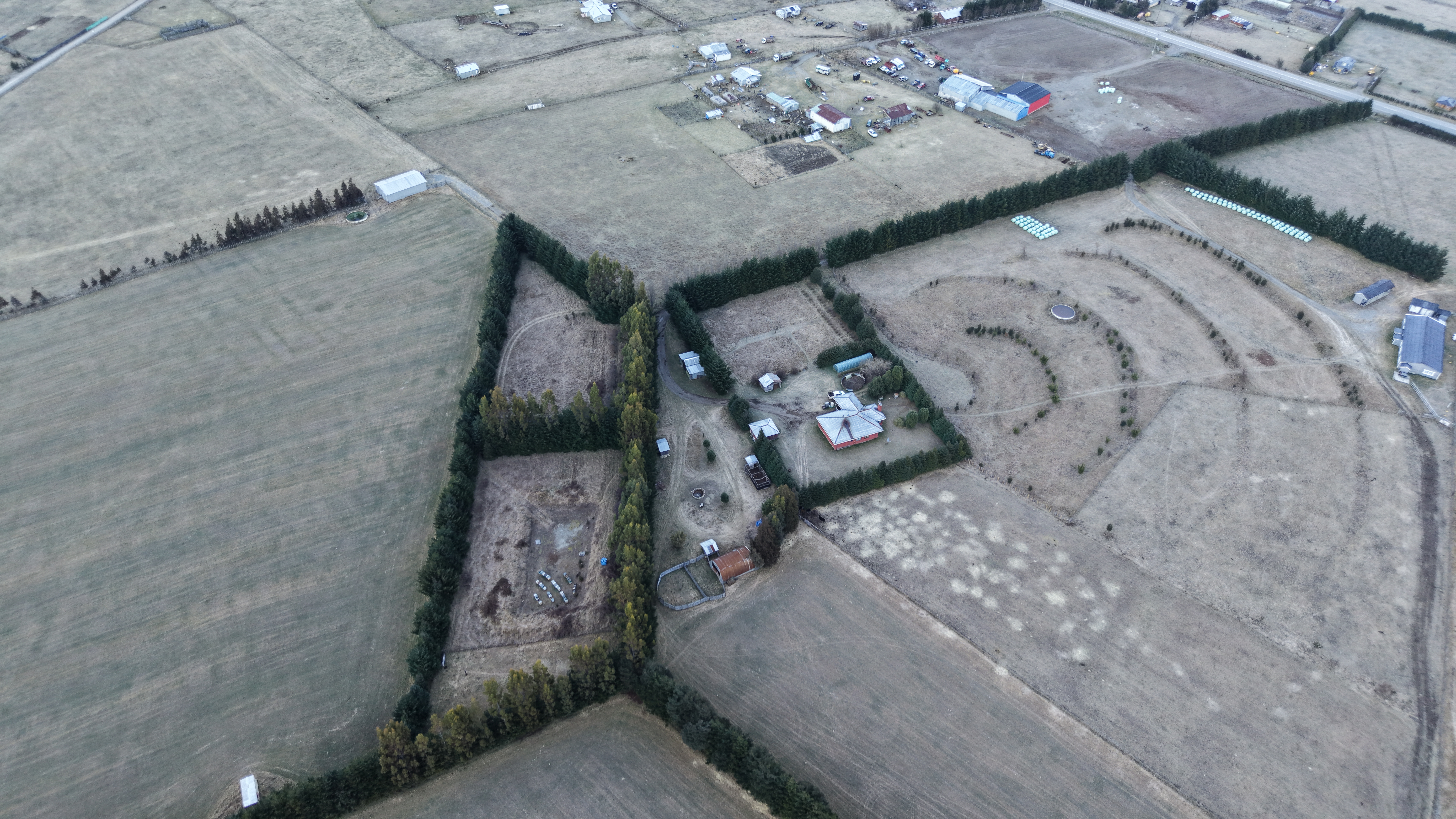 Aerial view of Fundo La Pampita with morning frost, August 2026